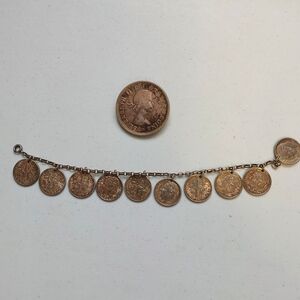 Silver coin bracelet and silver dollar brooch